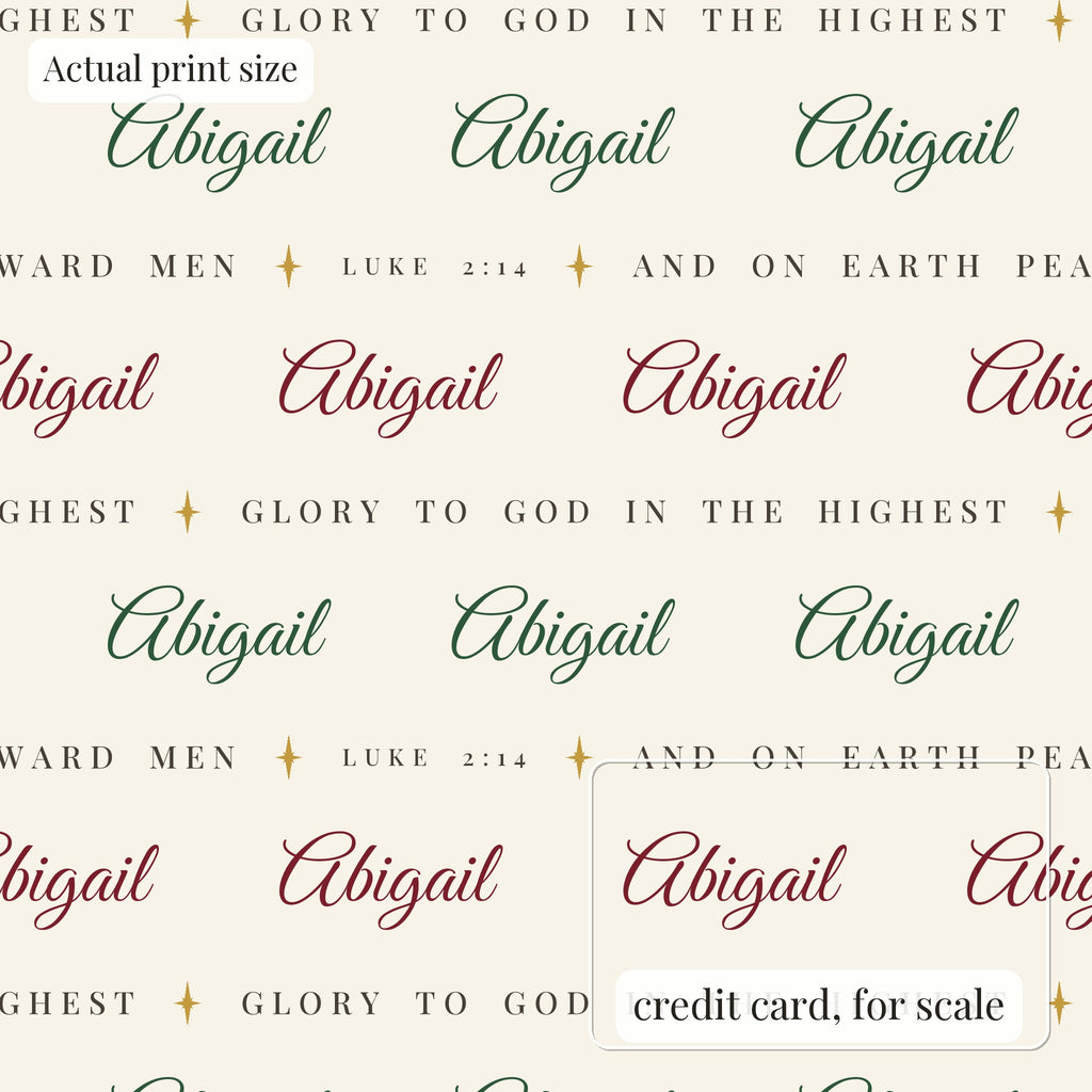 Personalized Luke 2:14 scripture Christmas paper in ivory at actual print size, with a credit card outline for scale