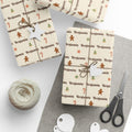 Gifts wrapped in personalized Christmas cookies paper in cream with the name Benjamin, tied with twine