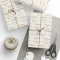 Gifts wrapped in personalized farmhouse Christmas paper reading Merry Christmas from The Miller Family, tied with twine