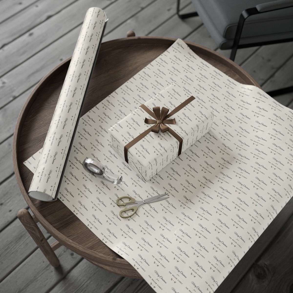 Personalized farmhouse family wrapping paper roll and a wrapped gift on a wooden table