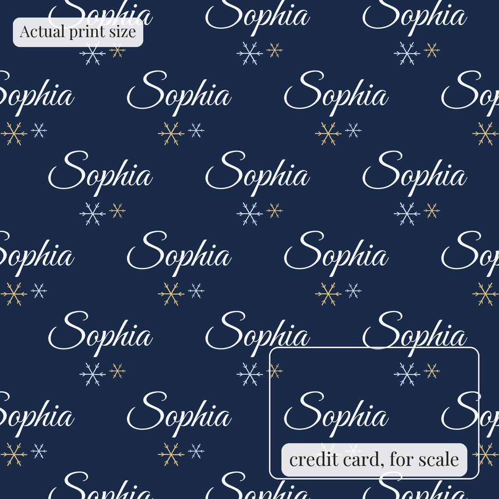 Navy snowflake personalized wrapping paper at actual print size, with a credit card outline for scale