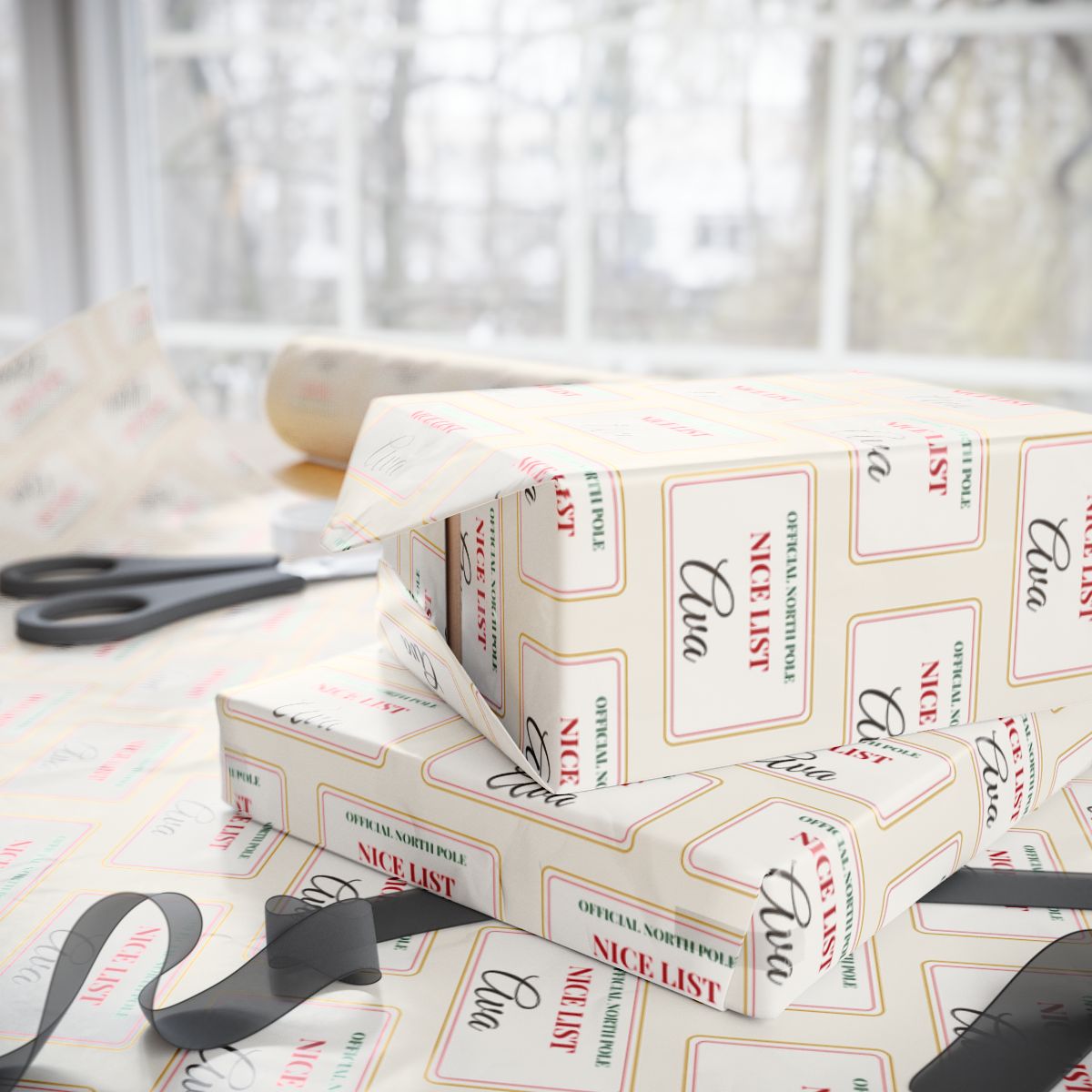 Two gifts wrapped in personalized Nice List Christmas paper with the name Ava, on a table by the window