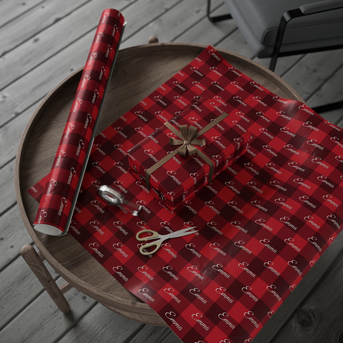 Personalized buffalo plaid wrapping paper roll and a wrapped gift on a wooden table