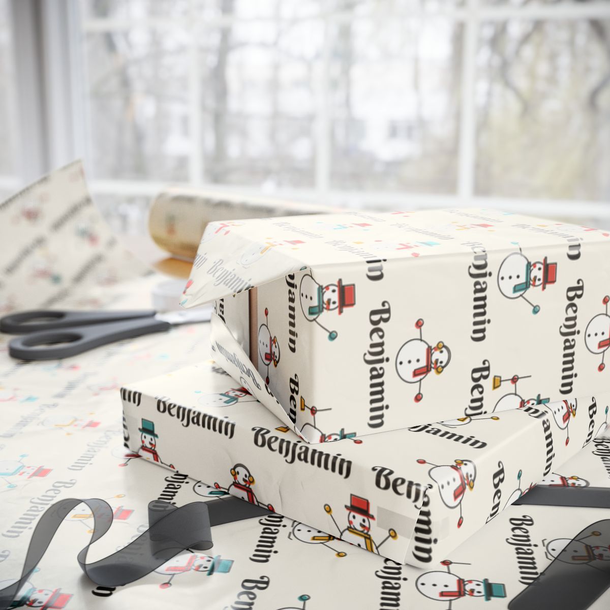 Two gifts wrapped in personalized snowman parade Christmas paper with the name Benjamin, on a table by the window