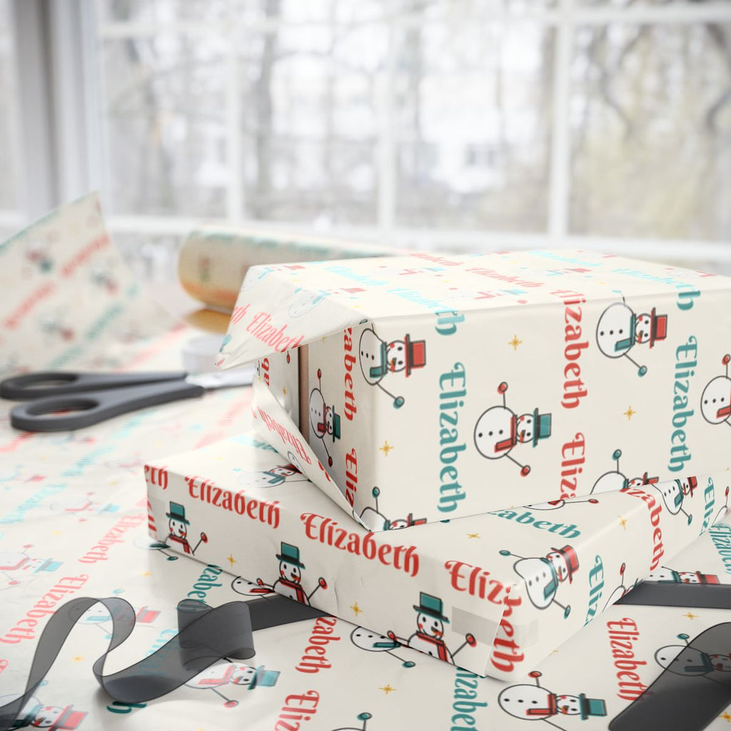 Two gifts wrapped in personalized retro snowman Christmas paper with the name Elizabeth, on a table by the window