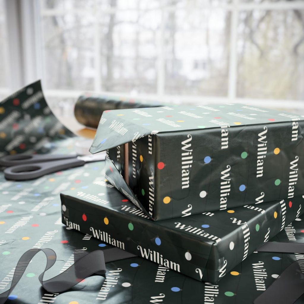 Two gifts wrapped in personalized string lights Christmas paper with the name William, on a table by the window