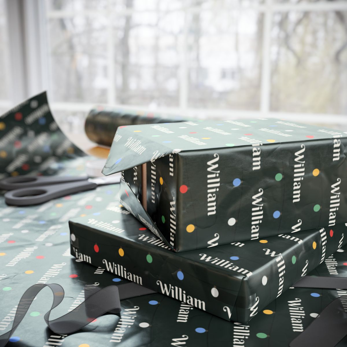 Two gifts wrapped in personalized string lights Christmas paper with the name William, on a table by the window